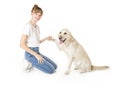 Nice teen woman and her beautiful Golden Retriever dog over white background Royalty Free Stock Photo