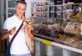 Nice teenage boy choosing dog treats