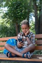 Nice thoughtful boy using his new smartphone Royalty Free Stock Photo