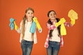 Nice and tidy. Girls with mist spray and rag ready for cleaning. Household duties. Little helper. Girls cute kids love Royalty Free Stock Photo