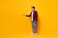 Portrait of happy young man posing at yellow studio Royalty Free Stock Photo