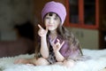 Nice toddler girl in purple hat Royalty Free Stock Photo