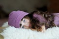 Nice toddler girl in purple hat Royalty Free Stock Photo