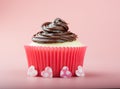 Nice vanilla Cupcake with chocolate icing pink background and four hearts Royalty Free Stock Photo