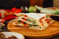 Nice vegetarian quesadilla with tortilla bread, beans, cheese and vegetables.