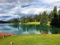 A nice view of a difficult par 4 on a golf course that demands your first drive off the tee carry a large lake Royalty Free Stock Photo