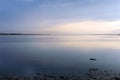 Nice view of the estuary. Sunset over the sea. Calm sea surface.