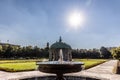 Nice view on the fountain near the pavilion of diana in the center of munich, germany, hofgarten with the theatine church in the