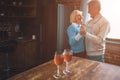 Nice and warm picture of old ouple dancing together in the kitch Royalty Free Stock Photo