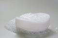 Nice white soap bar with foam Royalty Free Stock Photo