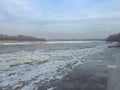 Winter begins and the river is covered with ice