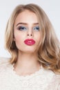 Nice woman with blonde hair and red lips makeup. Beautiful female face closeup portrait Royalty Free Stock Photo