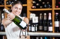 Woman buying wine in a winery Royalty Free Stock Photo