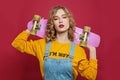 Nice woman with skateboard on red background