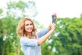 Nice woman taking pictures with smartphone Royalty Free Stock Photo