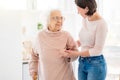 Nice woman supporting pensioner