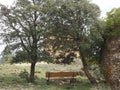 bench between alcinas looking at the hermitage of the Mare de Deu del Montsant, Alvarca, Tarragona, Spain, Catalonia Royalty Free Stock Photo