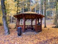 Nice wooden hikers shelter or pavilon in autumnal forest