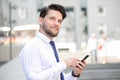 Nice young businessman holding mobile phone Royalty Free Stock Photo