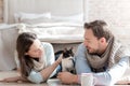 Nice young couple patting the cat Royalty Free Stock Photo