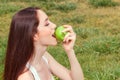 Nice young girl eating apple Royalty Free Stock Photo