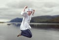 Nice young woman chef is jumping. She feel really happy. Royalty Free Stock Photo