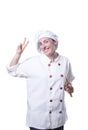 Nice young woman chef making victory gesture Royalty Free Stock Photo