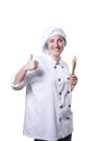 Nice young woman chef with thumb up and wood utensils Royalty Free Stock Photo