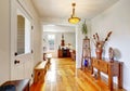 Nicely decorated entryway with vintage furniture.