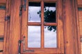 Nicely decorated window of a log cabin house. Royalty Free Stock Photo