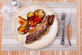 Delicious uruguayan style churrasco steak served with eggplant and pimento pepper