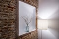 Niche in the exposed brick wall of a vacation rental apartment with decoration