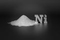 Nickel is a metal widely used in metallurgy and electronics. A handful of silver-white nickel metal powder and the