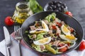 Nicoise salad with tuna, green beans, basil and fresh vegetables Royalty Free Stock Photo