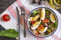 Nicoise salad with tuna, green beans, basil and fresh vegetables Royalty Free Stock Photo