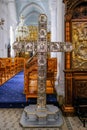 Nicosia, Cyprus - May 14, 2018: Icon of a large silver cross depicting the stations of the cross and free standing in the Holy