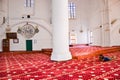 Nicosia, Cyprus - Oct 4 2018: Man photographer lying on the floor and taking picture of amazing interior of islamic Selimiye