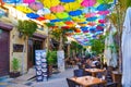 Nicosia, Cyprus - Oct 4th 2018: Outdoor cafe with amazing colorful umbrellas decorating the top of the street