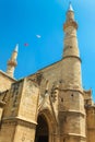 NICOSIA, NORTHERN CYPRUS - MAY 30, 2014: View on The Selimiye mosque ex. St. Sophia Cathedral and flags of Turkey Royalty Free Stock Photo