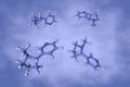 Nicotine, an alkaloid present in the nightshade family of plants. Molecular model on blue background. Scientific