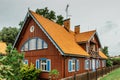 Nida,Lithuania- August 10,2019. Beautiful colorful traditional wooden architecture. Resort town on Curonian Spit. Typical