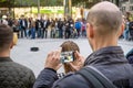 A man photographing videoing in public Royalty Free Stock Photo