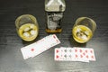 Poker and a glass of whiskey with ice. Royalty Free Stock Photo