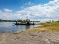 Nieszawa, Poland - August 11, 2021. Unique motorized craft lateral circular ferry sidewheeler crossing the Vistula river in Summer