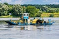 Nieszawa, Poland - August 11, 2021. Unique motorized craft lateral circular ferry sidewheeler crossing the Vistula river in Summer