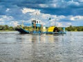 Nieszawa, Poland - August 11, 2021. Unique motorized craft lateral circular ferry sidewheeler crossing the Vistula river in Summer