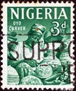 NIGERIA - CIRCA 1961: A stamp printed in Nigeria shows Oyo carver, circa 1961. Royalty Free Stock Photo