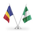 Nigeria and Romania table flags isolated on white 3D rendering