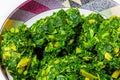 Nigeria, Yoruba cuisine; Close up a bowl of efo, or green leafy vegetables