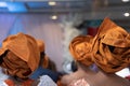 Nigerian american woman gele headtie at wedding